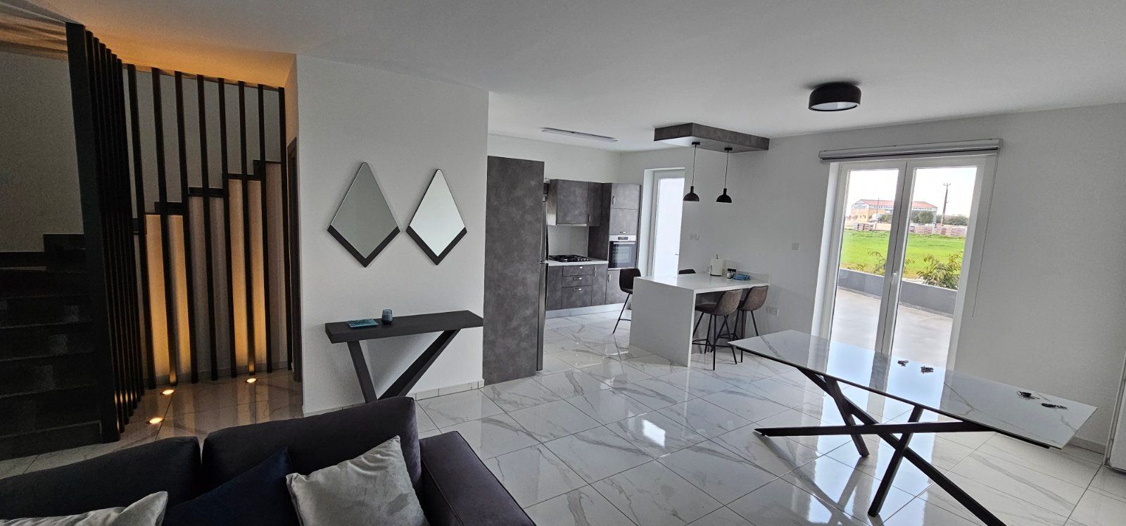 Modern white villa with infinity pool overlooking the Mediterranean sea